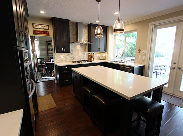 Foothill Ranch Black & White U-Shaped Transitional Kitchen Renovation with Custom Cabinets